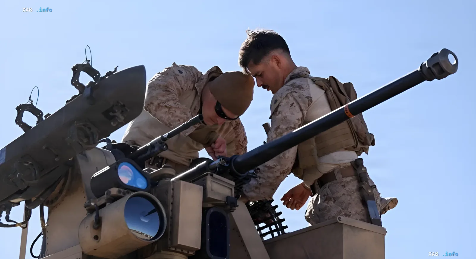 US military personnel inspect an anti-aircraft gun as part of a drone defense system being tested in the Philippines