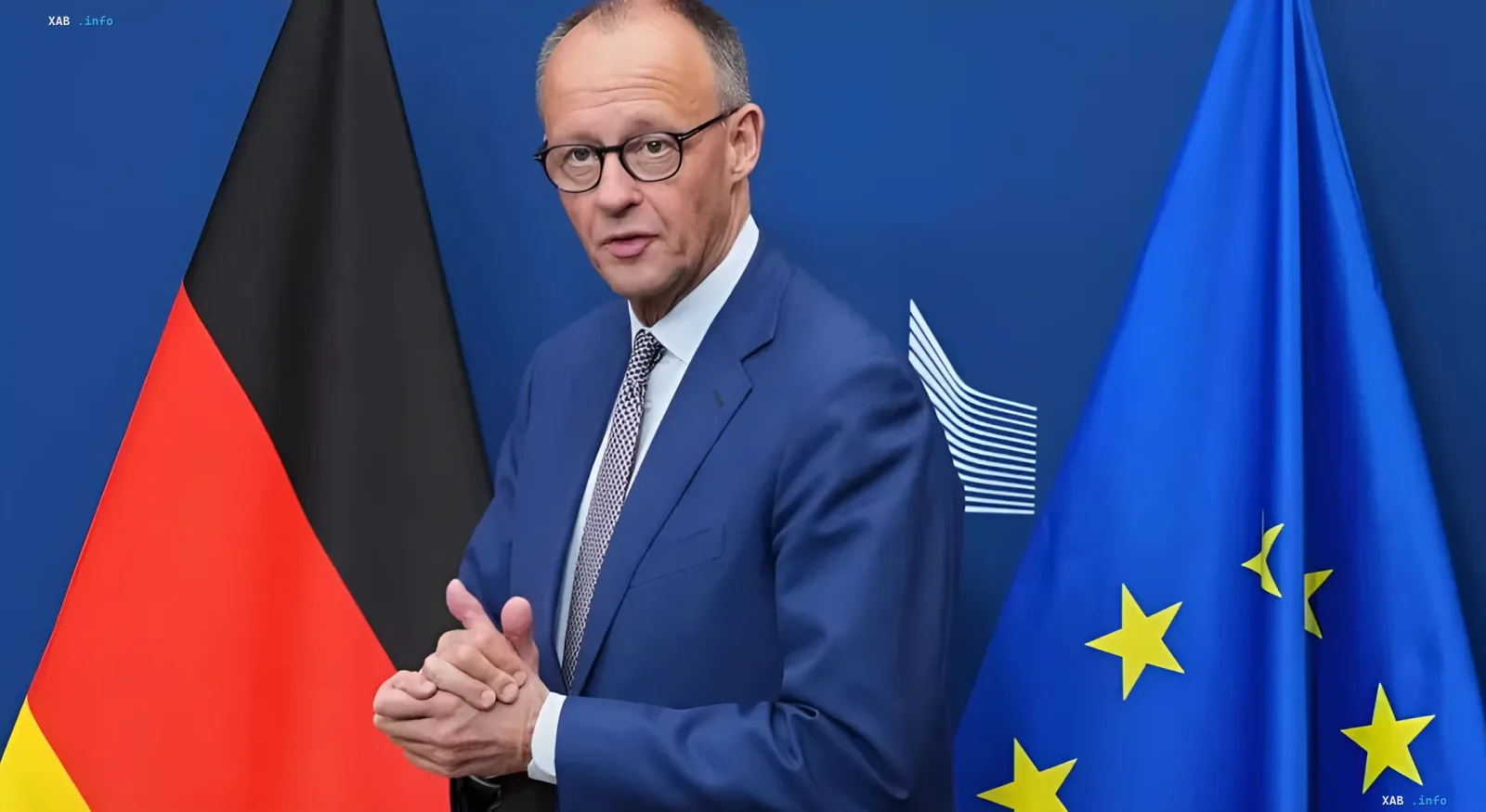 Friedrich Merz in front of the flags of Germany and the EU, discussing prospects and economic opportunities for 450 million consumers
