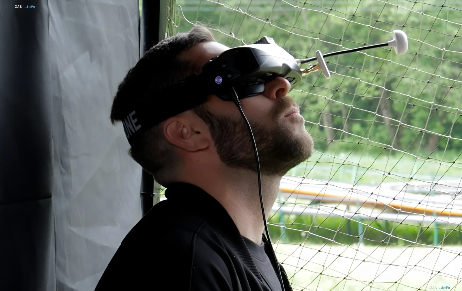 Ukrainian soldier in Truskavets uses VR goggles to control drones, participating in an aerial battle