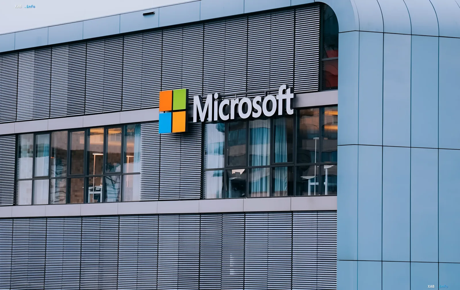 Microsoft logo on the facade of a modern office building, symbolizing the presentation of its own AI model lineup and new security standards.