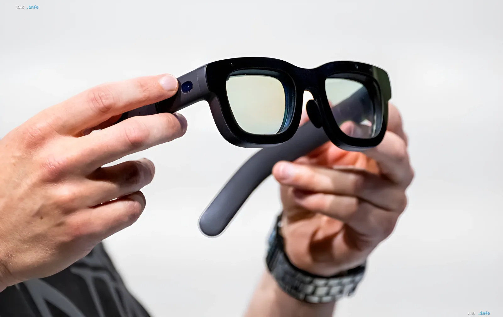 Ray-Ban Meta smart glasses with face recognition camera, held in hands