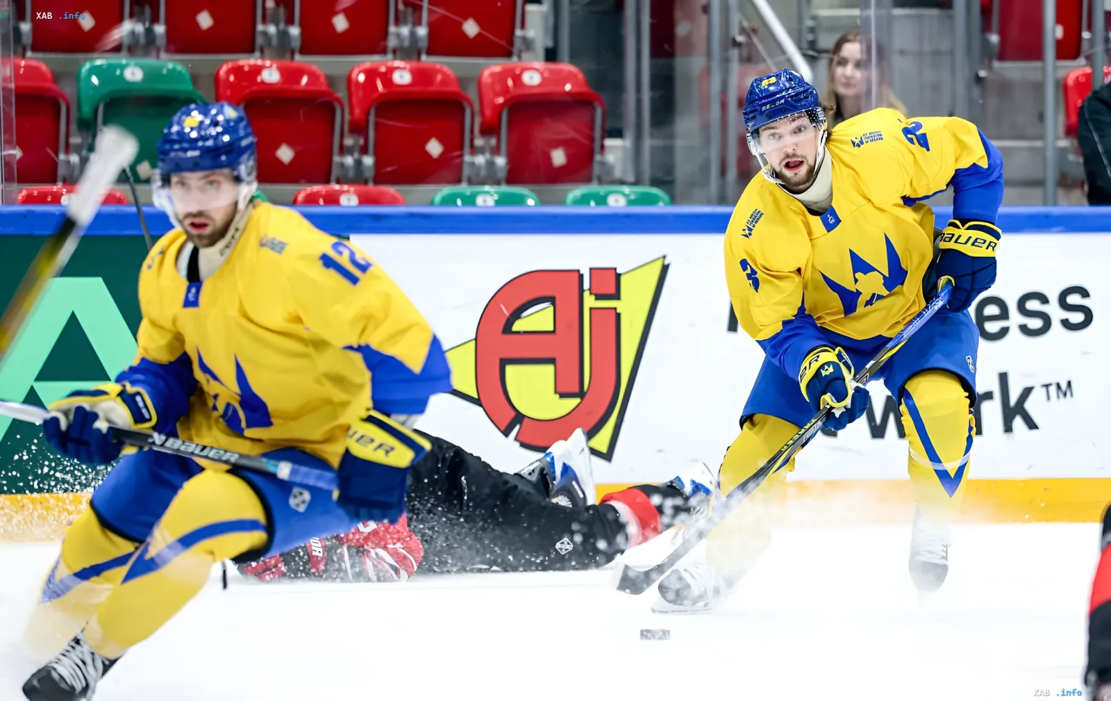 Swedish national hockey team players in yellow and blue uniforms during an intense match, potential rivals for Ukraine at the 2027 World Championship