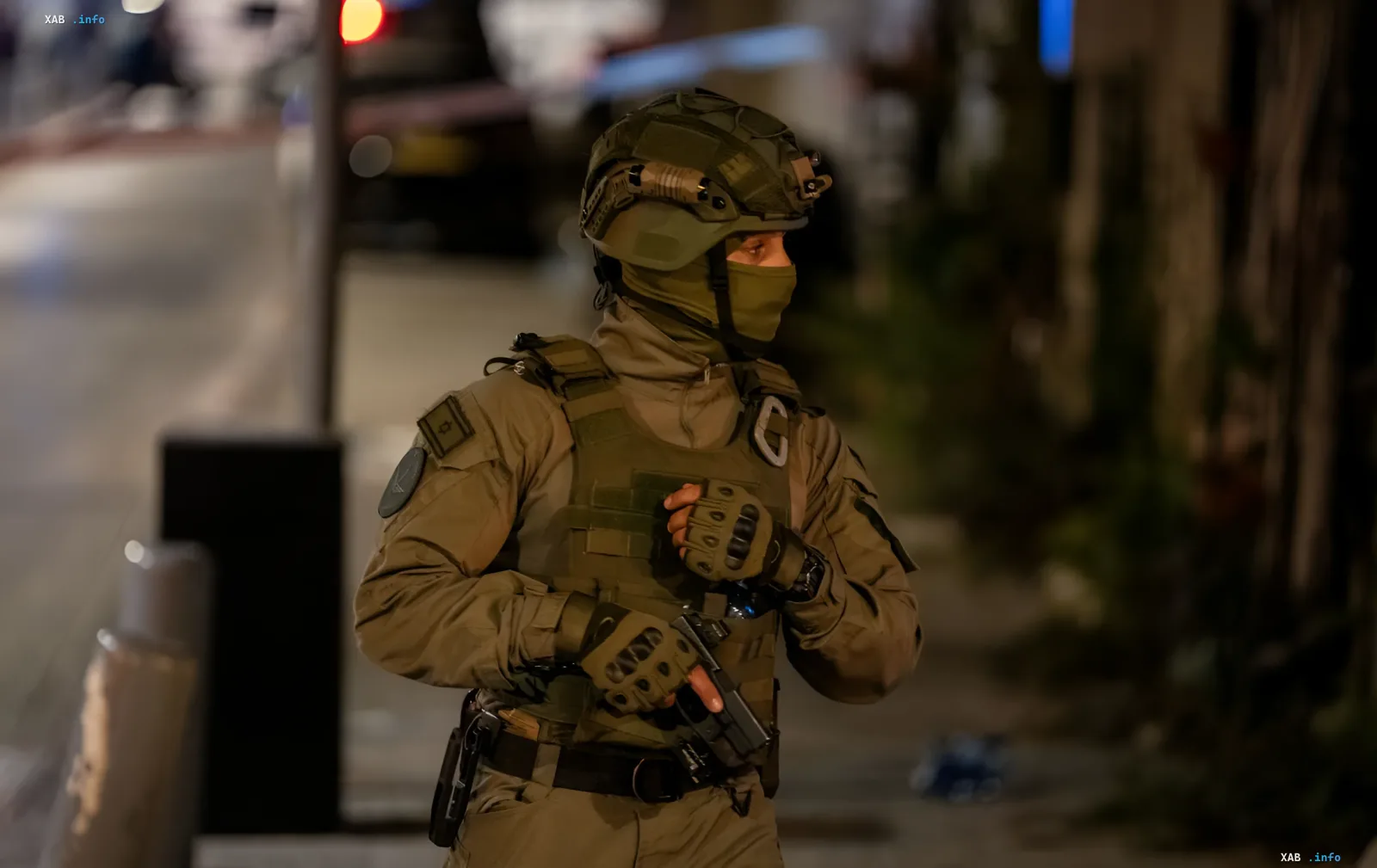 Israeli special forces soldier in full gear on night patrol after ceasefire violation with Iran