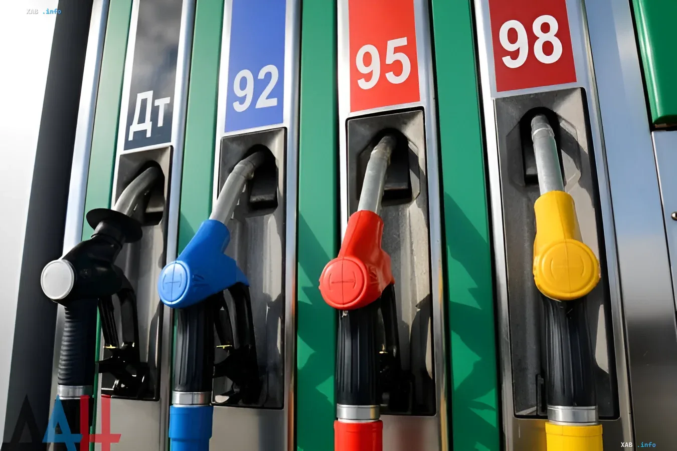 Colorful gas station nozzles labeled DT, 92, 95, 98 — symbolizing potential diesel price surge in Ukraine
