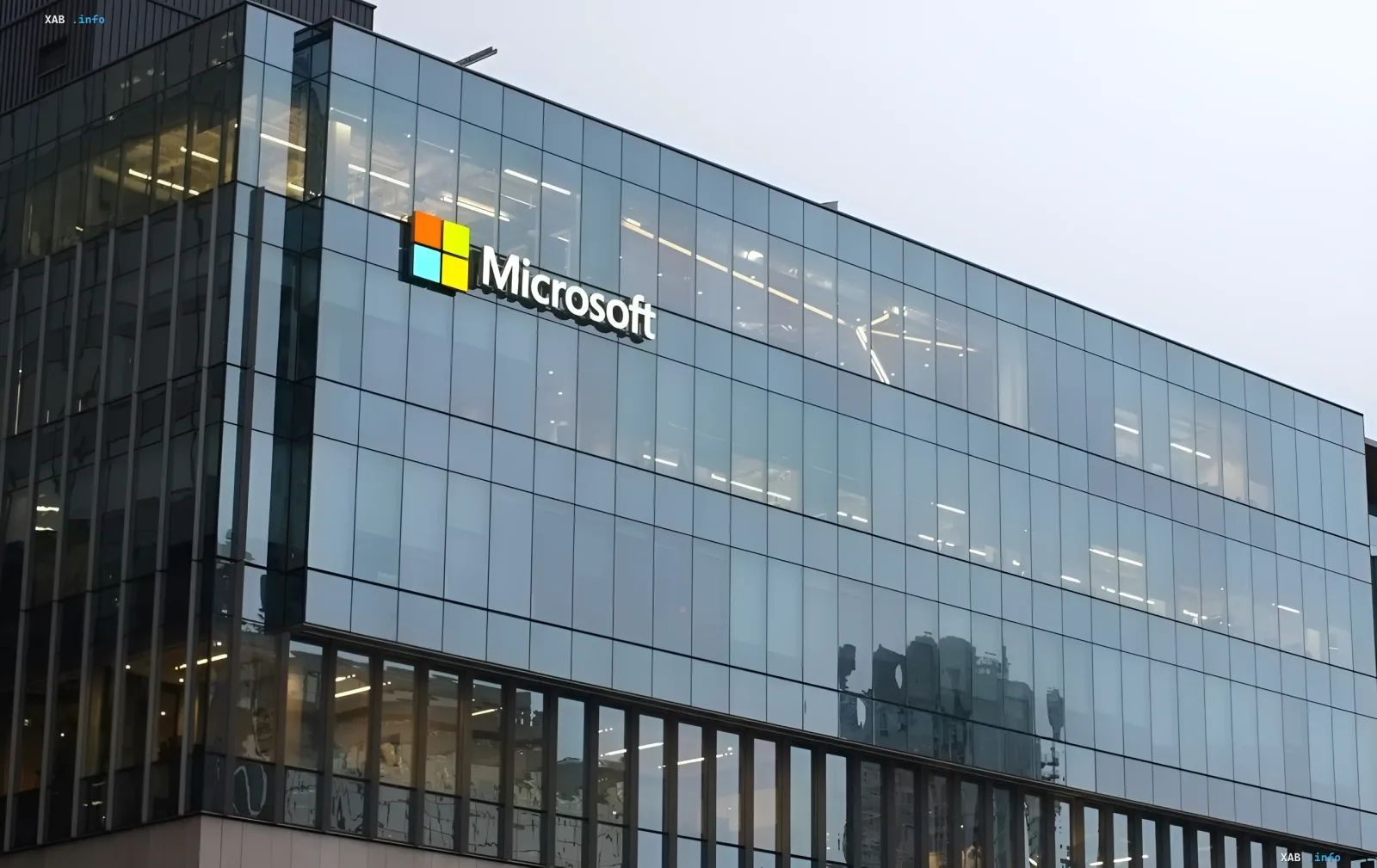 Microsoft office building with logo on the facade, related to the news about the hack and poisoning of open-source projects for stealing developers' passwords