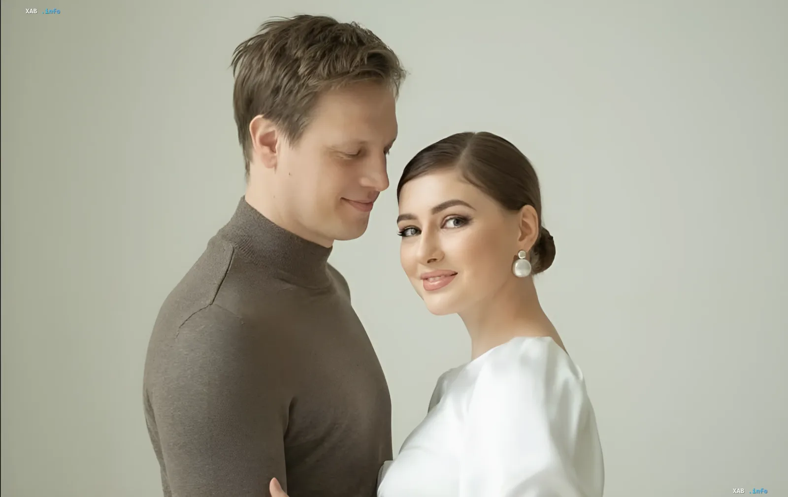 Ekaterina Tyshkevich and Valentin Tomusiak in a tender pose, expecting their first child