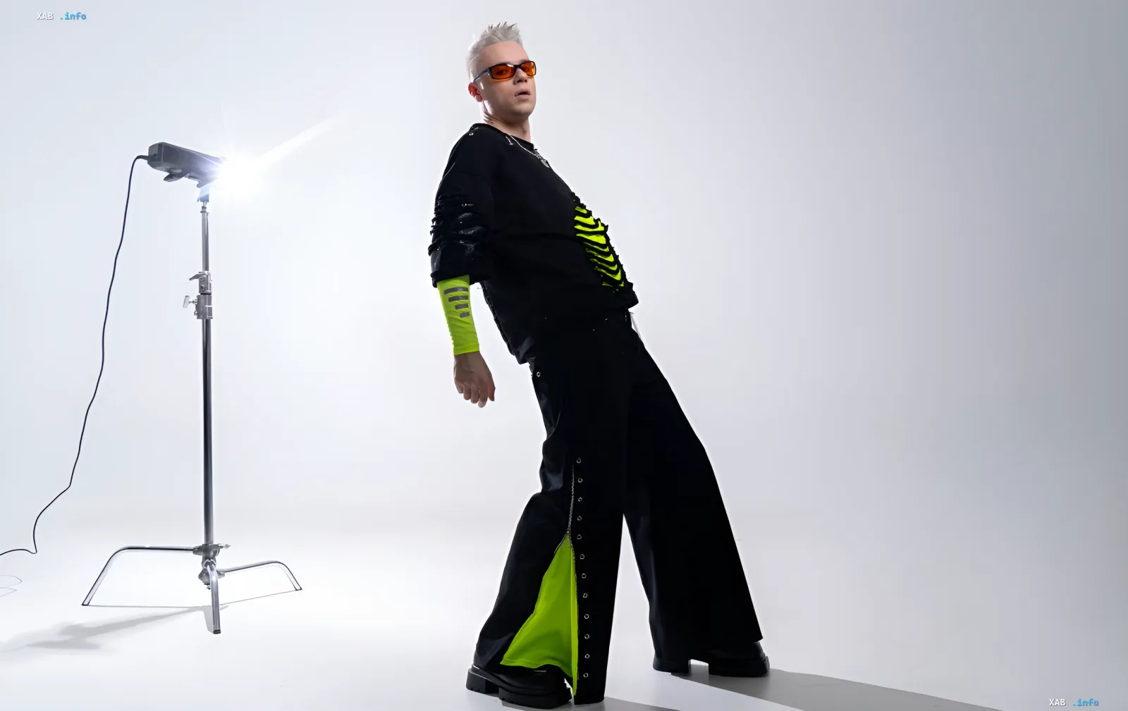 RukhankoMen in bold new look: black outfit with neon accents, white hair and orange sunglasses — symbol of comeback after breakup