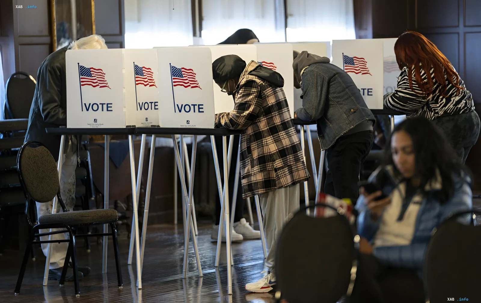 Voters casting ballots in the US, illustrating the theme of interference in political processes