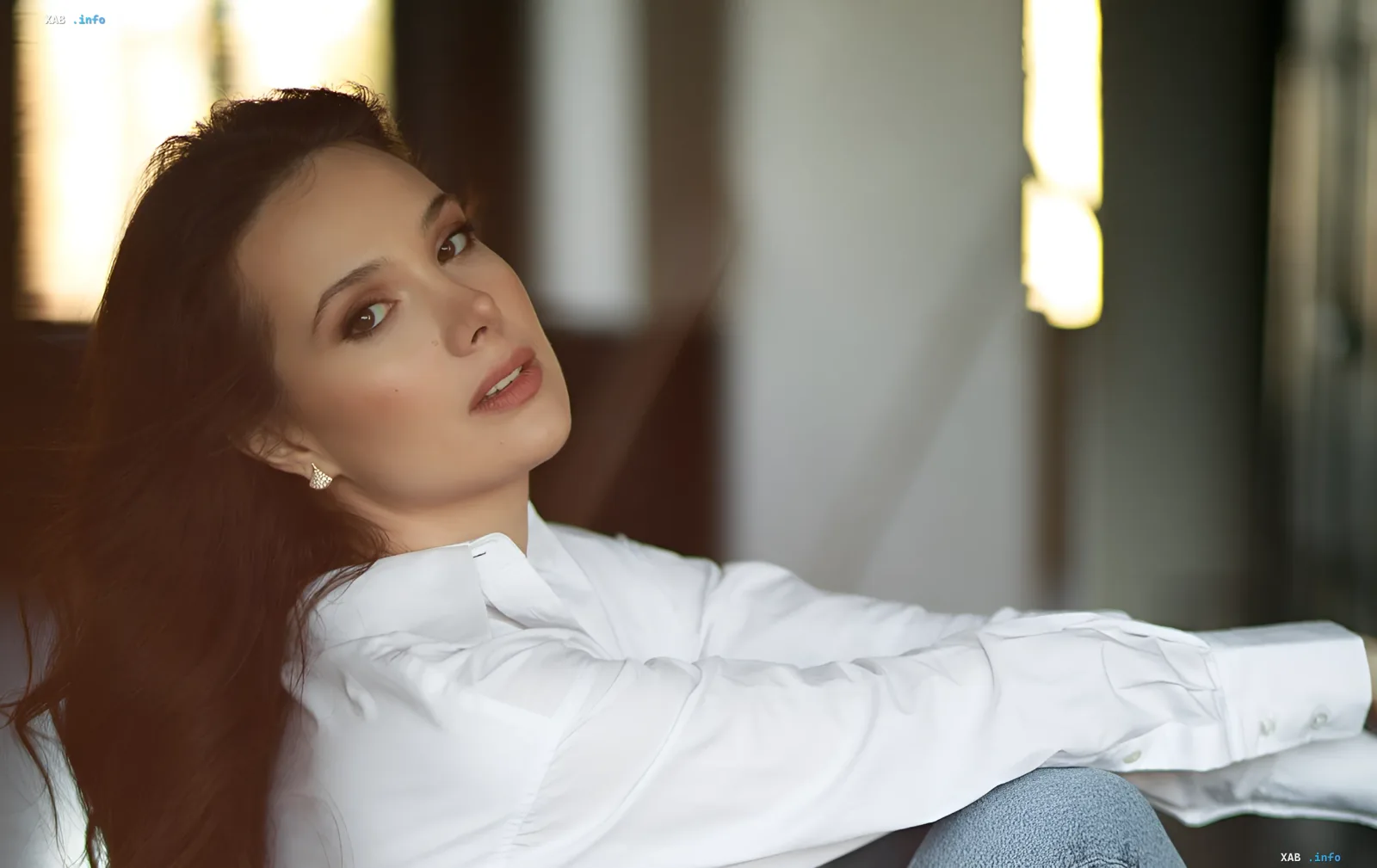 Ekaterina Bilyk in a white shirt, sharing her story of narrowly avoiding tragedy