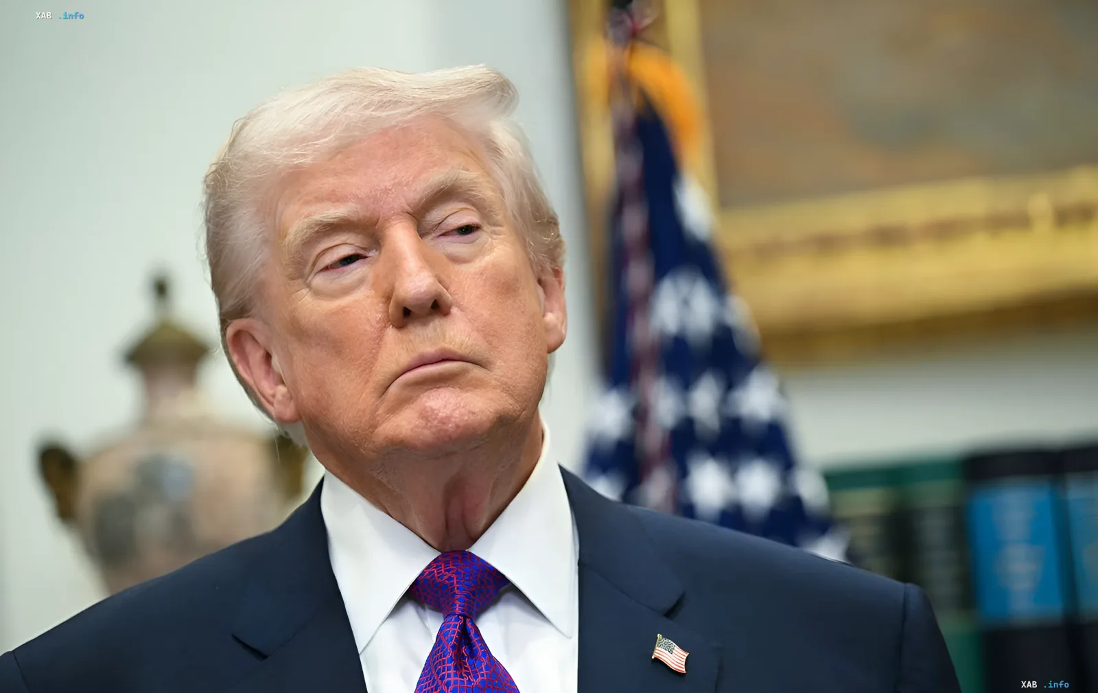 Donald Trump in a formal setting, with the US flag in the background, symbolizing the seriousness of the ultimatum to Iran