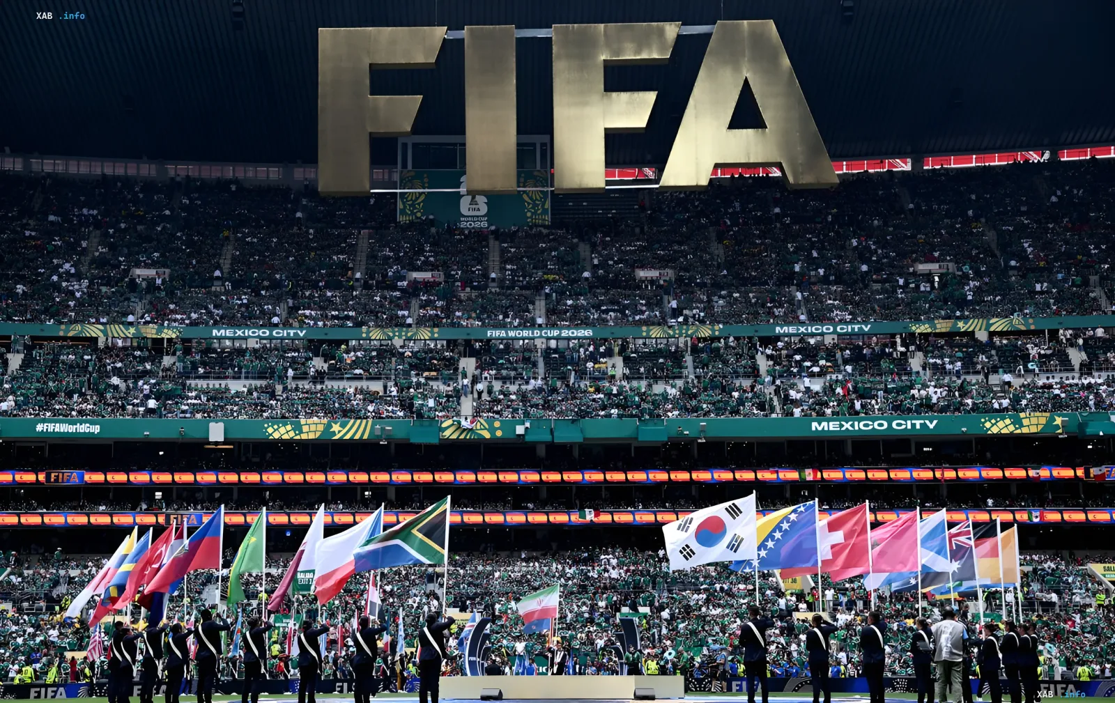 Opening ceremony of the 2026 World Cup in Mexico City: flags of participating nations in front of the stadium with FIFA logo and Mexico City inscription