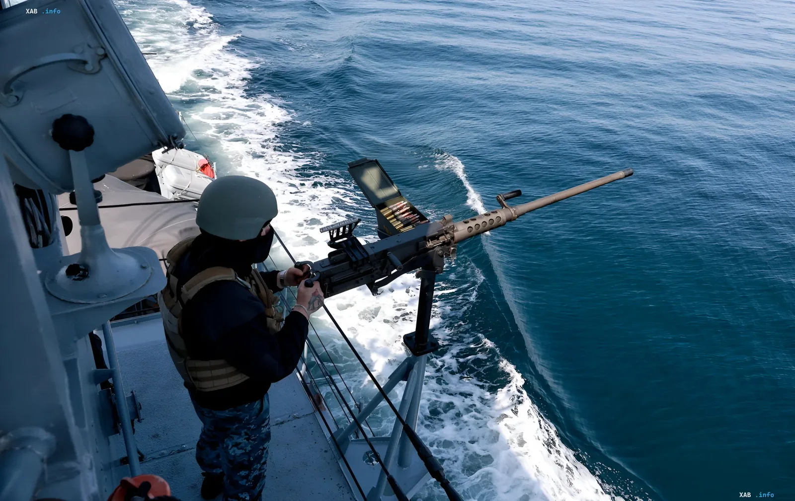 Ukrainian Navy sailor on combat duty with a machine gun against the backdrop of a sea wave, illustrating readiness to defend Odesa
