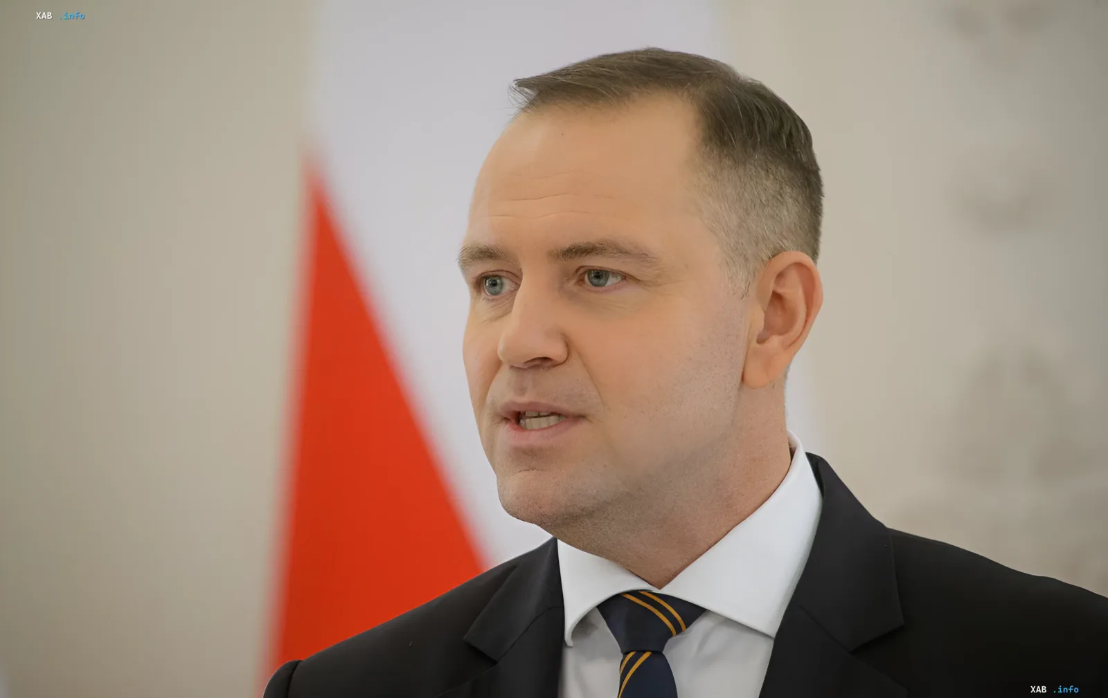 Polish President Andrzej Duda in front of the Polish flag, amid diplomatic conflict over his absence from the Gdansk conference