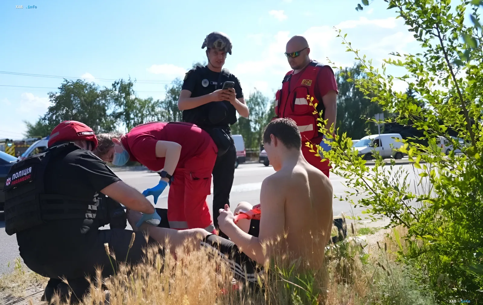 Medical personnel and police assist a victim after an attack on a beach in Zaporizhzhia