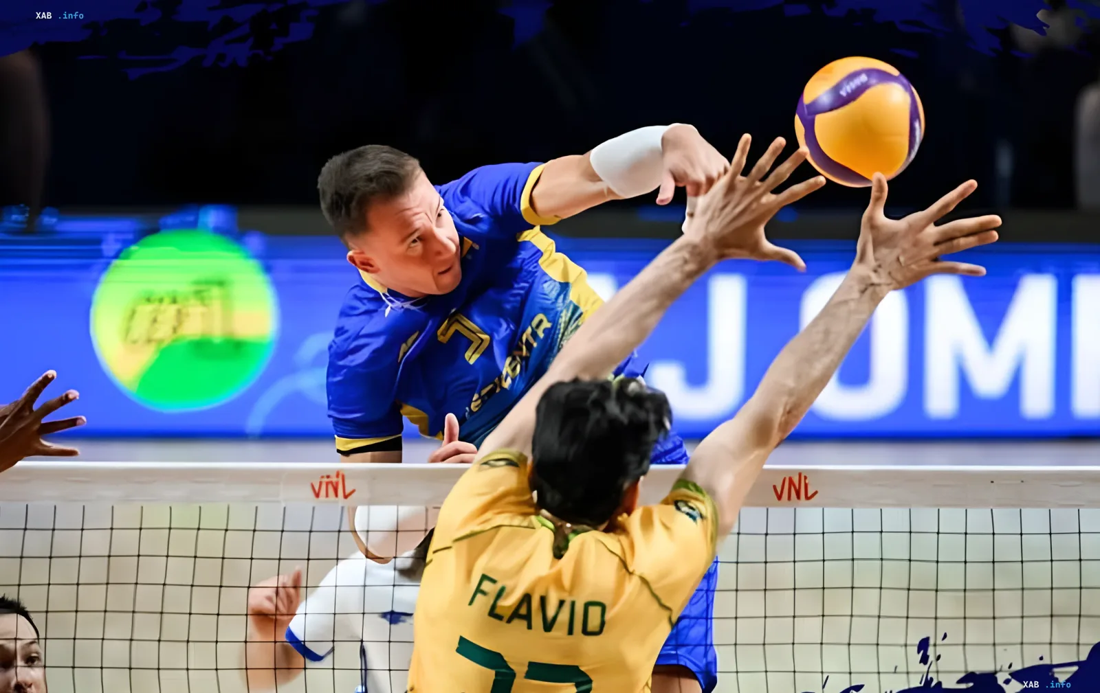 Ukrainian volleyball player in blue jersey attacks the ball over the net, blocking Brazilian player Flavio in yellow jersey, historic victory of Ukraine over Brazil