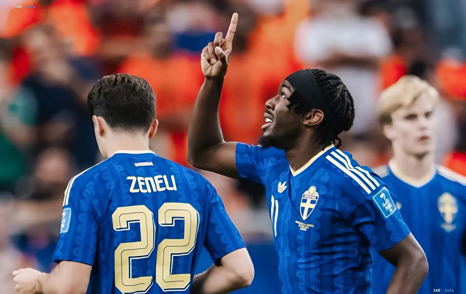 Swedish national team players celebrate victory in decisive World Cup 2026 match, pointing to sky after advancing to knockout stage