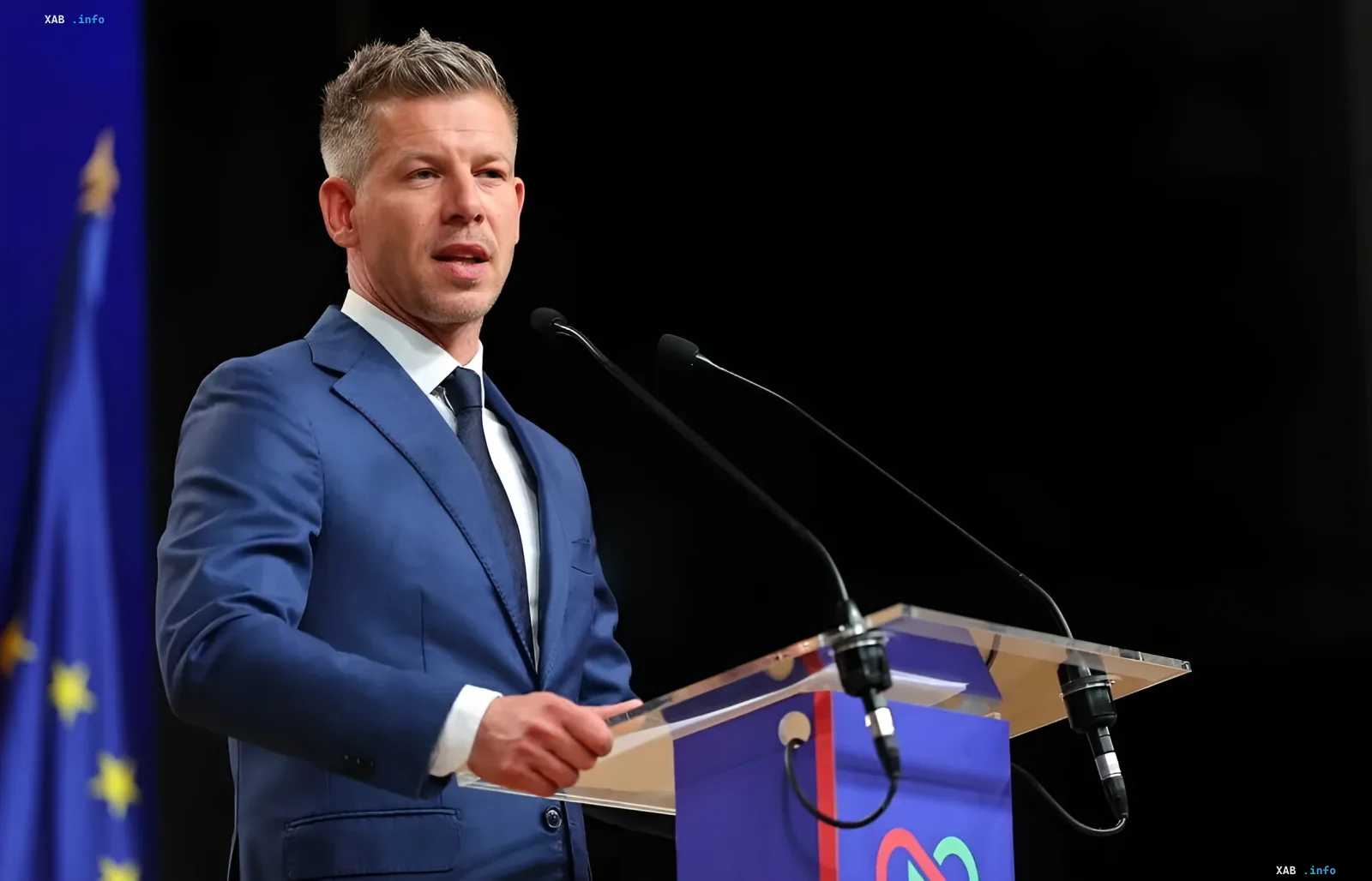 Hungary's new Prime Minister Peter Magyar delivers a speech against the backdrop of the EU flag, symbolizing the tension between Budapest and Brussels regarding Ukraine's EU integration.