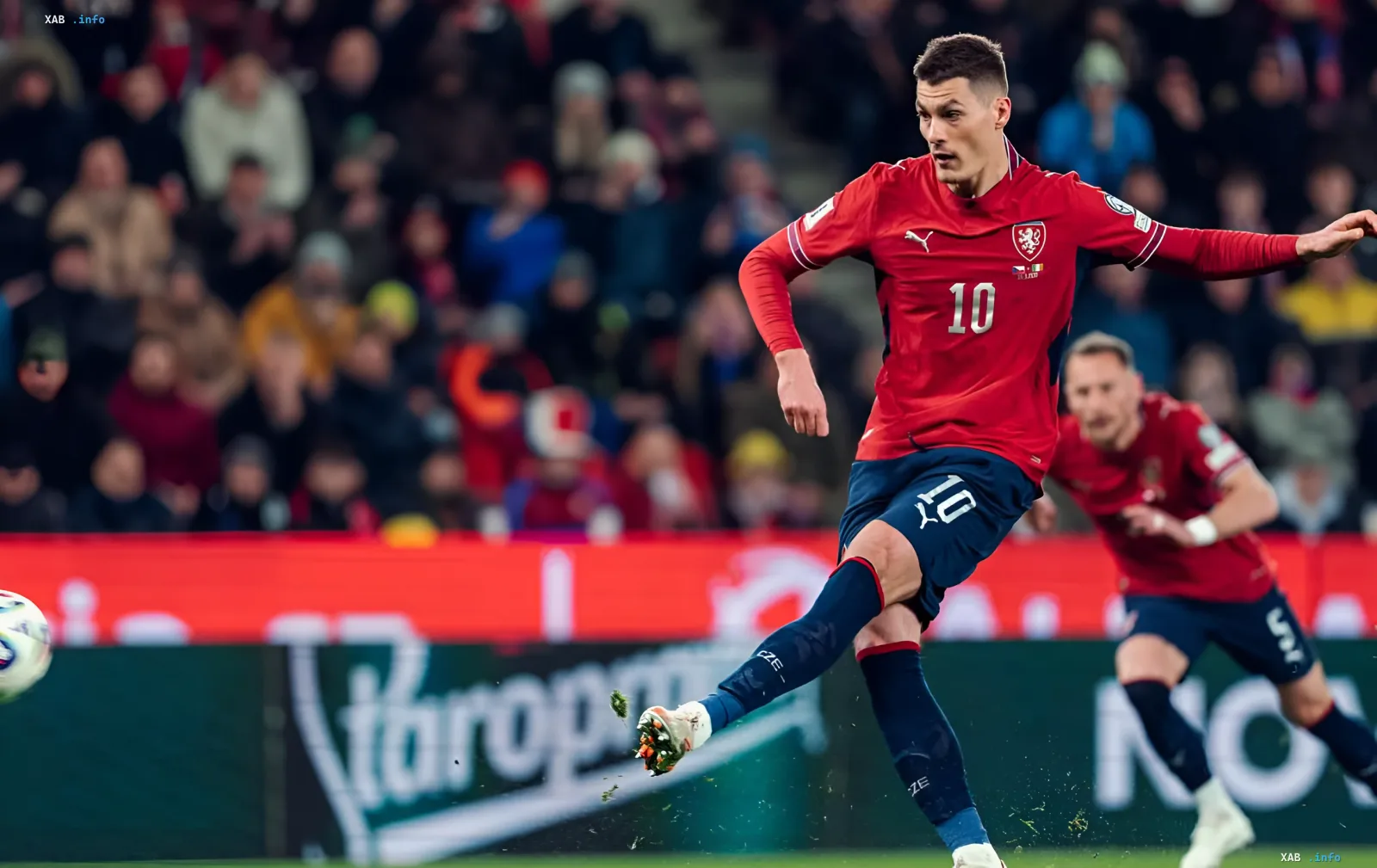 Patrik Schick in the red Czech national team jersey number 10 kicking the ball during a match