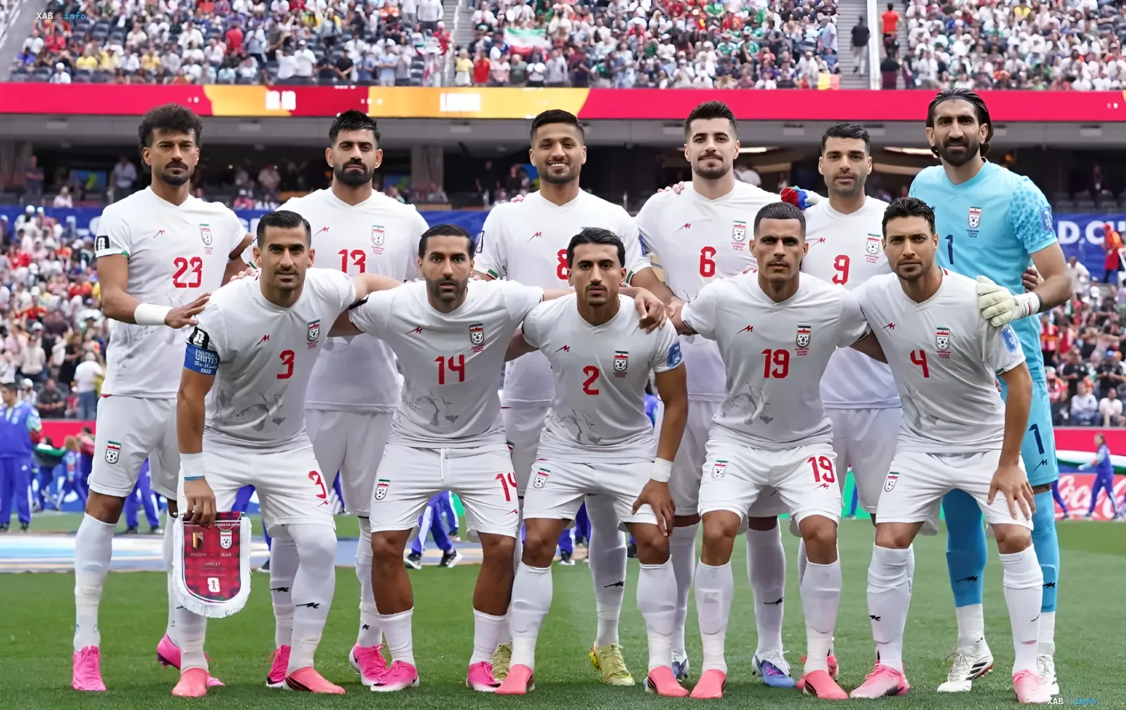 Team photo of the Iranian national football team in white kits on a stadium background, illustrating the visa scandal before the match with Egypt at the 2026 World Cup