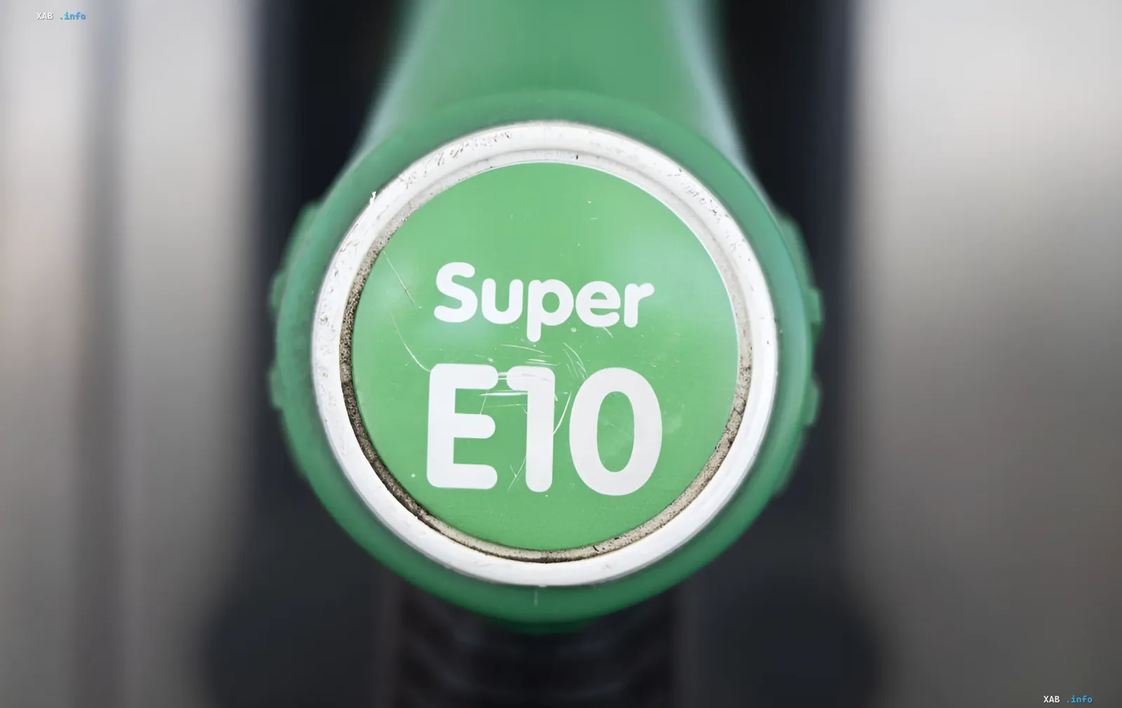 Green fuel nozzle labeled Super E10, symbolizing the transition to eco-friendly gasoline in Ukraine starting July 1