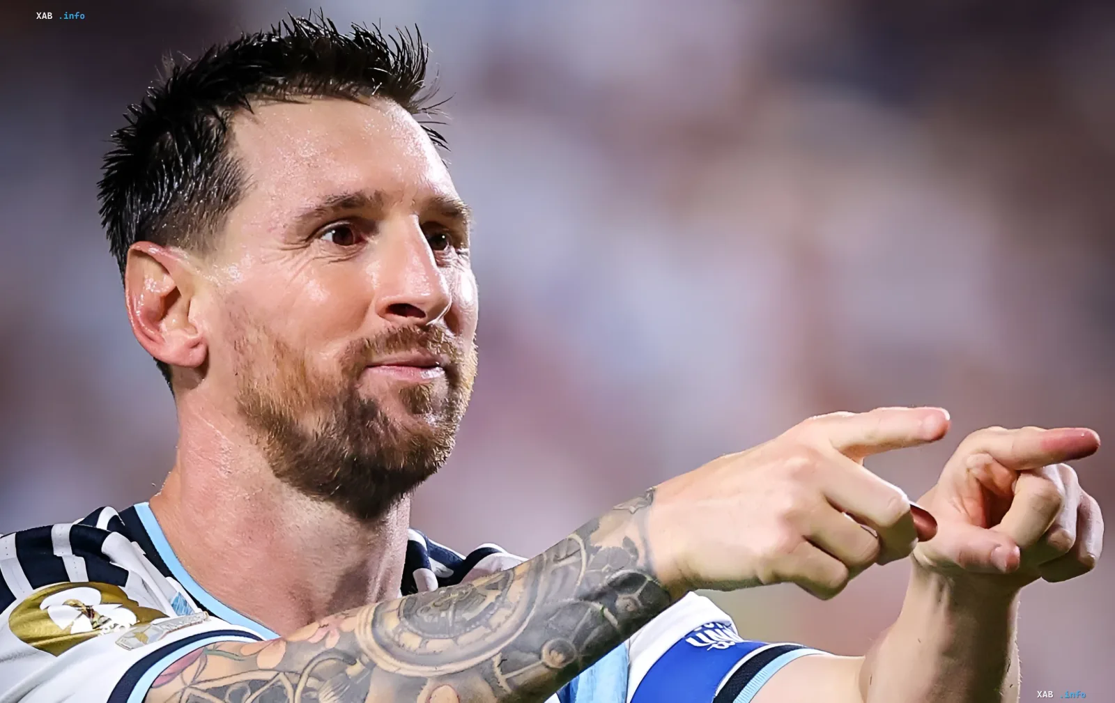 Lionel Messi in Argentina jersey pointing forward, symbolizing leadership in the race for WC-2026 record