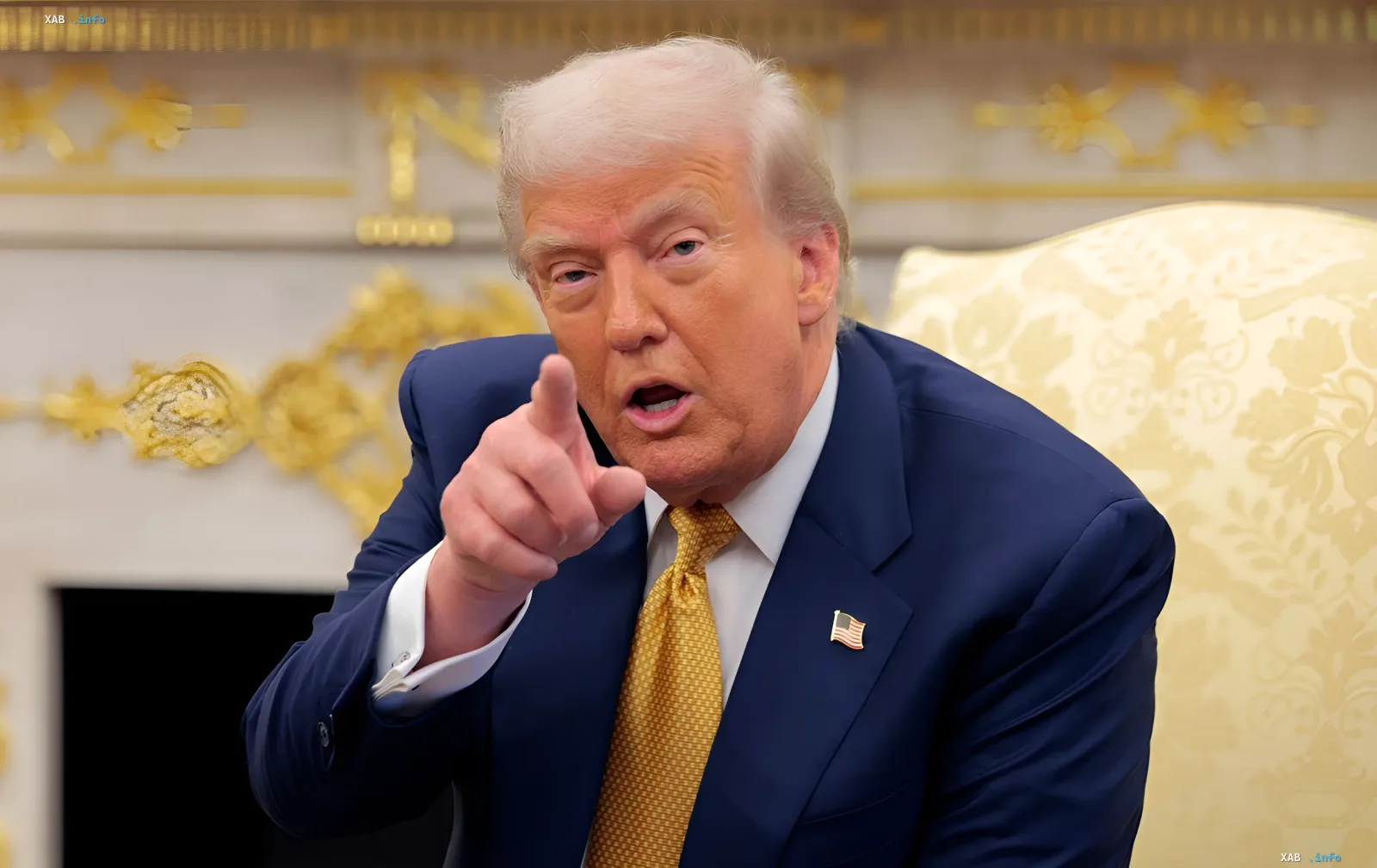 Donald Trump in a blue suit pointing while delivering speech calling Democrats 'godless communists' ahead of elections