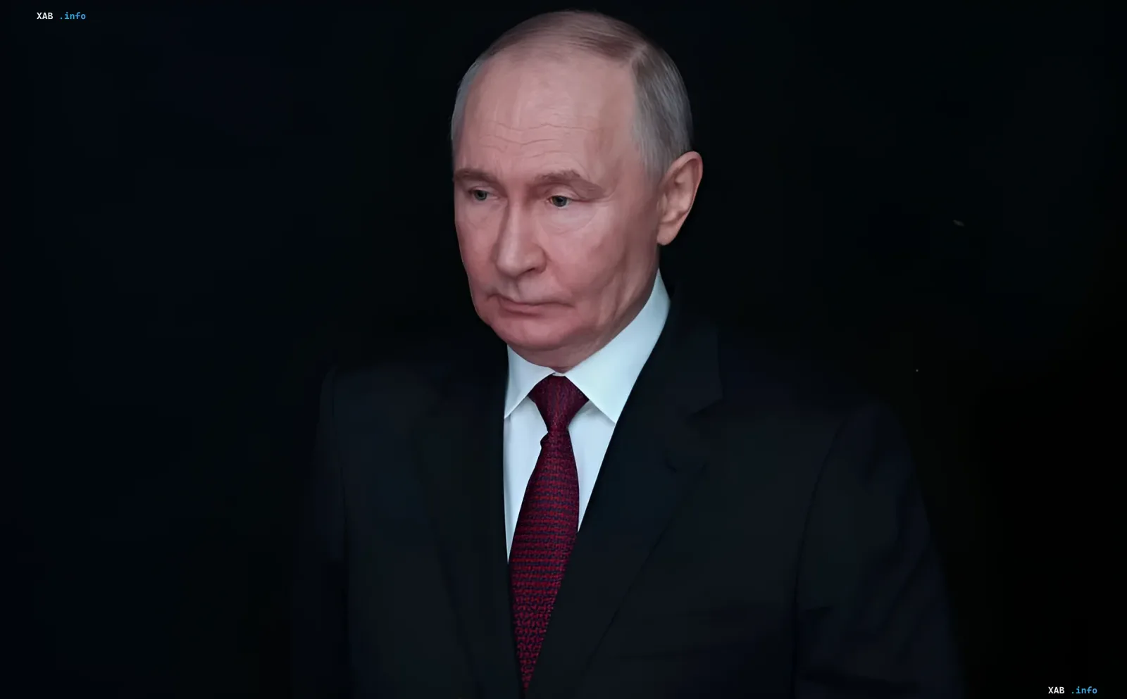 Vladimir Putin in a black suit and red tie against a dark background, serious expression, in the context of refusing ceasefire and fuel shortage