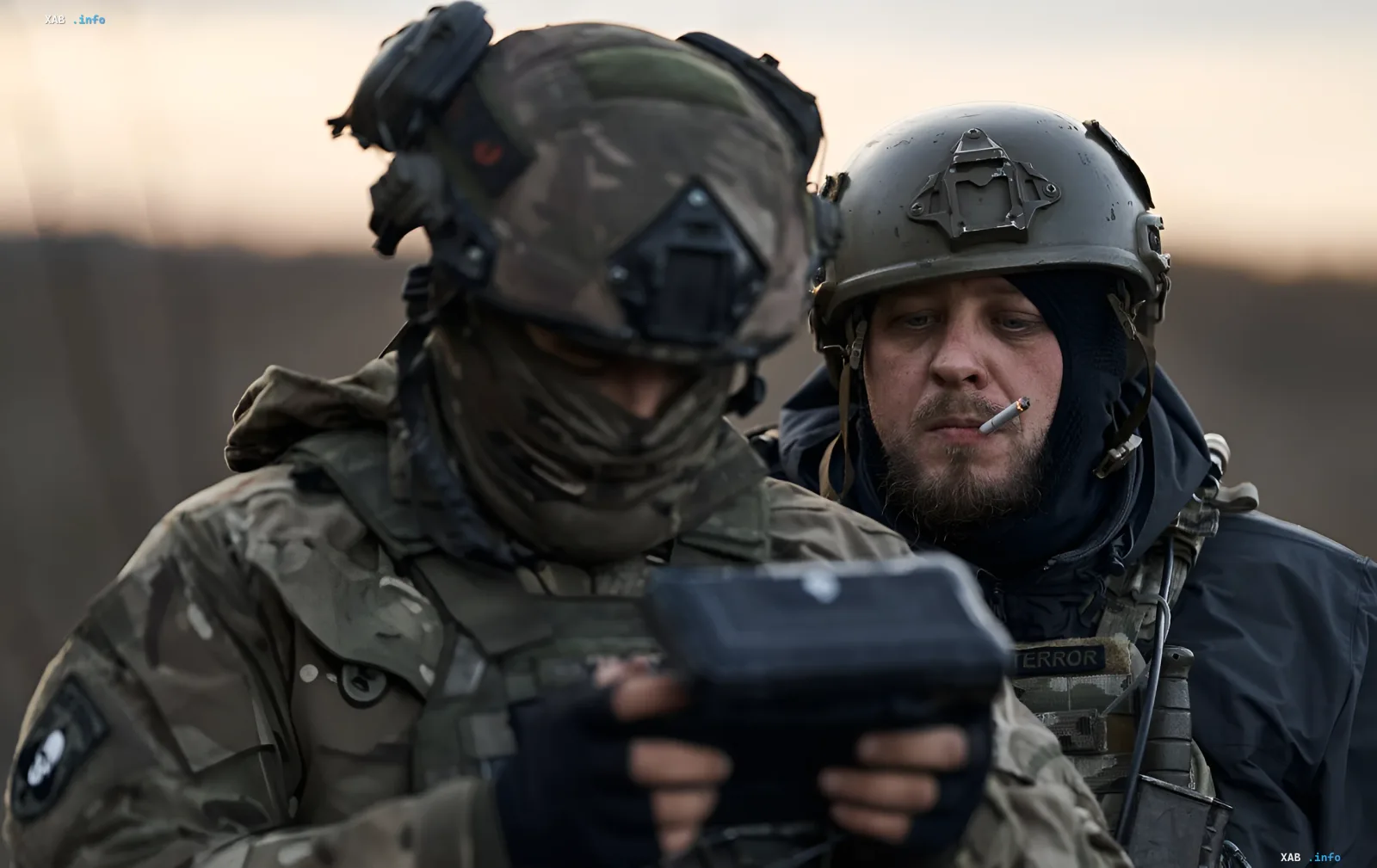 Ukrainian soldiers analyze data on a tablet after strikes on logistics in Crimea and communication facilities in the Moscow region