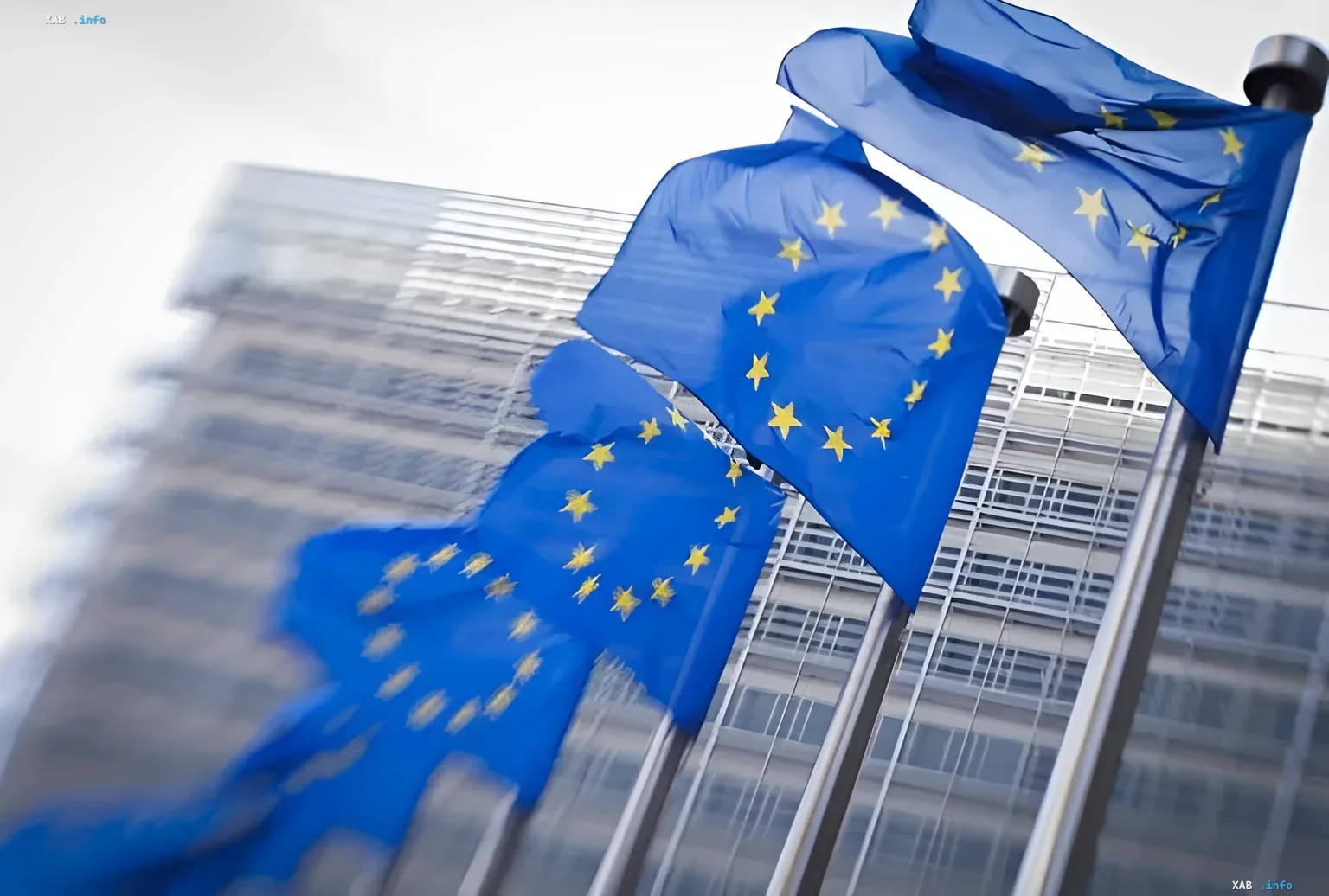 European Union flags waving in front of the European Commission building in Brussels, symbolizing the rejection of returning to Russian gas