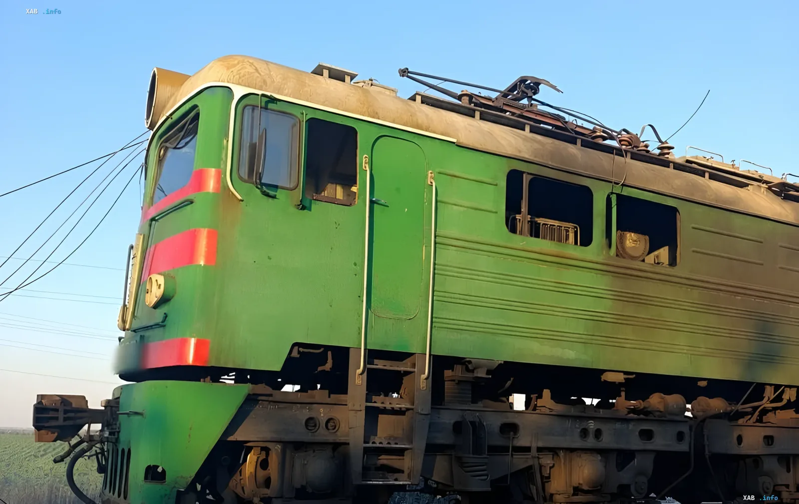 Damaged green electric locomotive in Dnipropetrovsk region after Russian drone attack