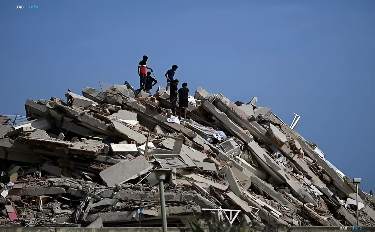 People on the ruins of a destroyed building after a strong earthquake in Venezuela