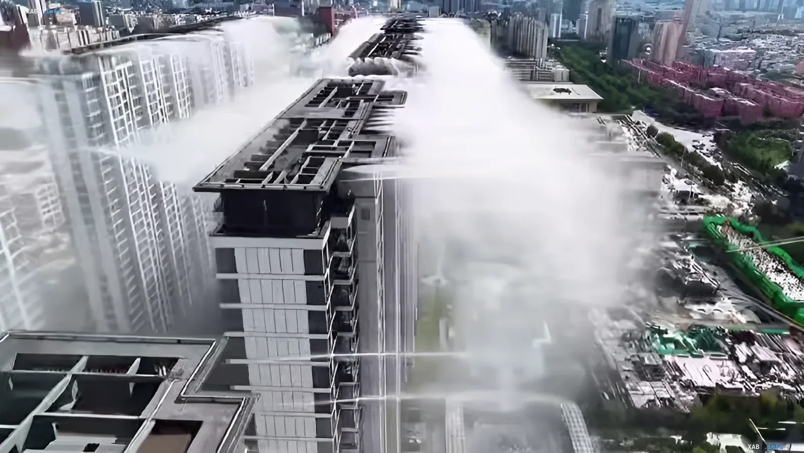 Yuncheng city cooling system: water spraying from high-rise buildings High-rise misting systems create dense fog over residential buildings in the Chinese city of Yuncheng to combat heat