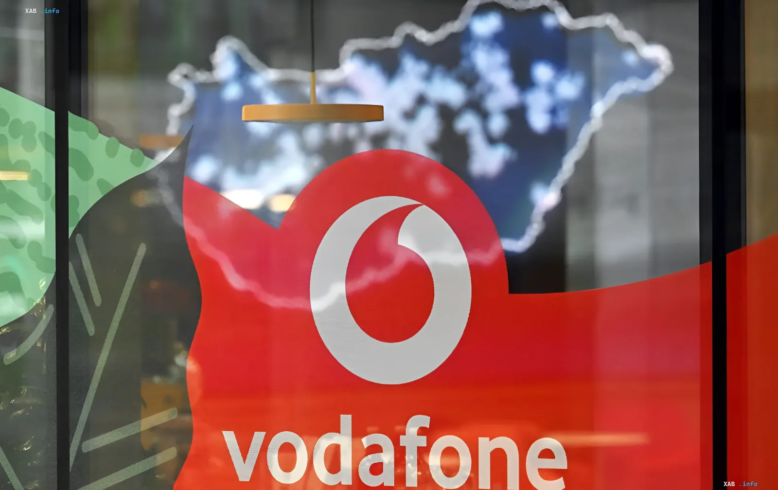 Vodafone logo on office window in Kyiv after shelling — warning about internet outages