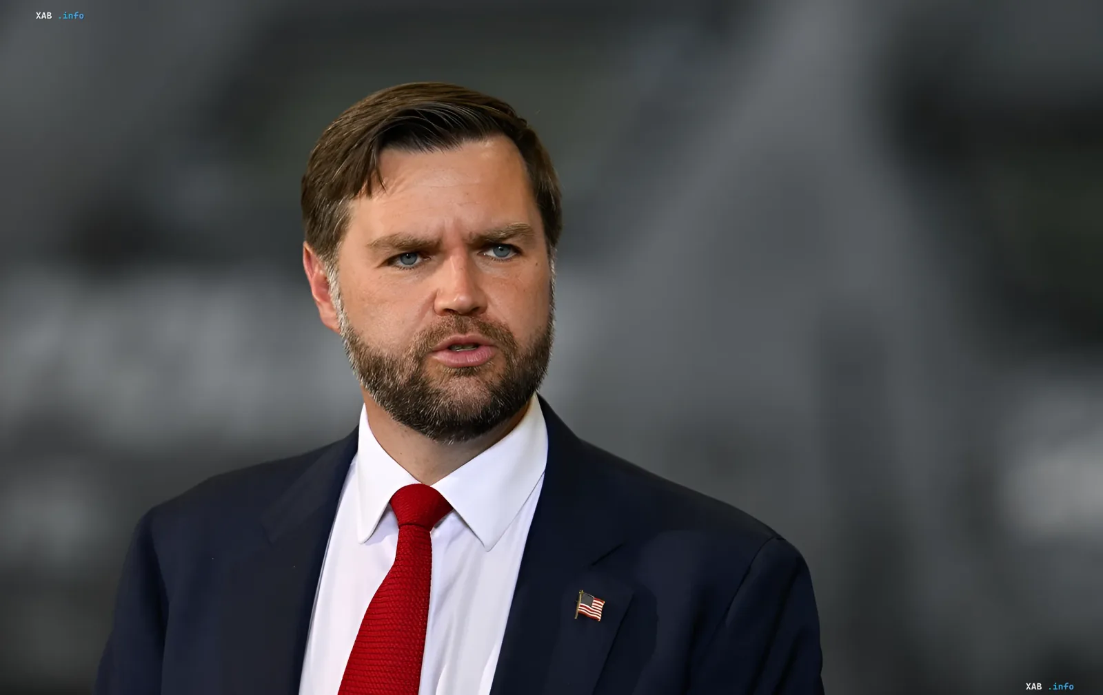 JD Vance in a suit with an American flag on his lapel, discussing Ukraine's strategy in the conflict with Russia