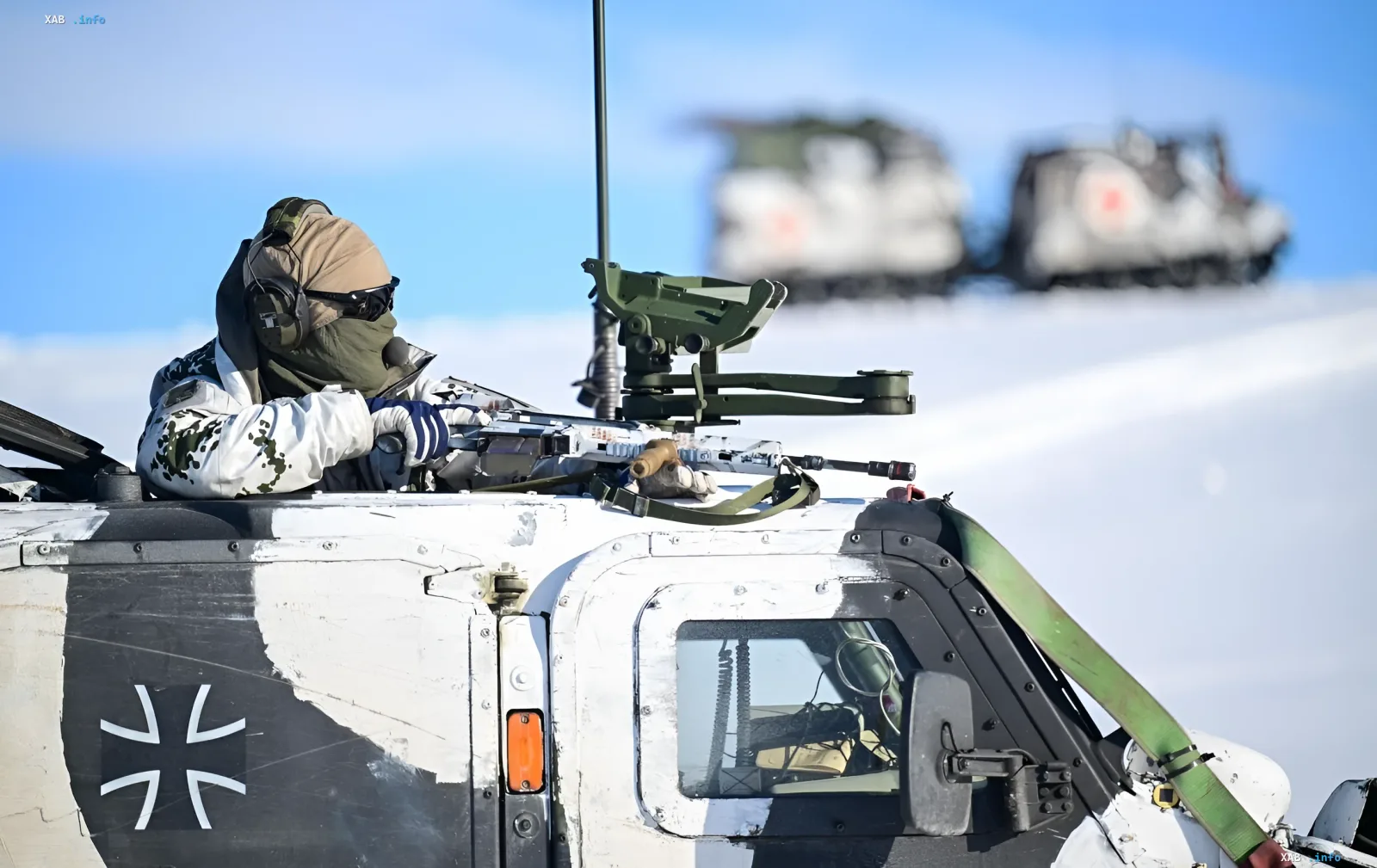 German soldier on an armored vehicle in winter conditions, symbolizing the increase in NATO military spending