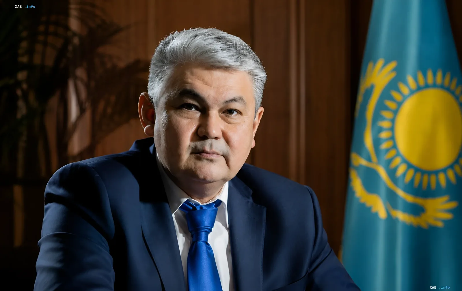 Official photo of a Kazakh Foreign Ministry representative in front of the national flag, illustrating the republic’s stance on allegations of drone attacks on the Omsk Refinery