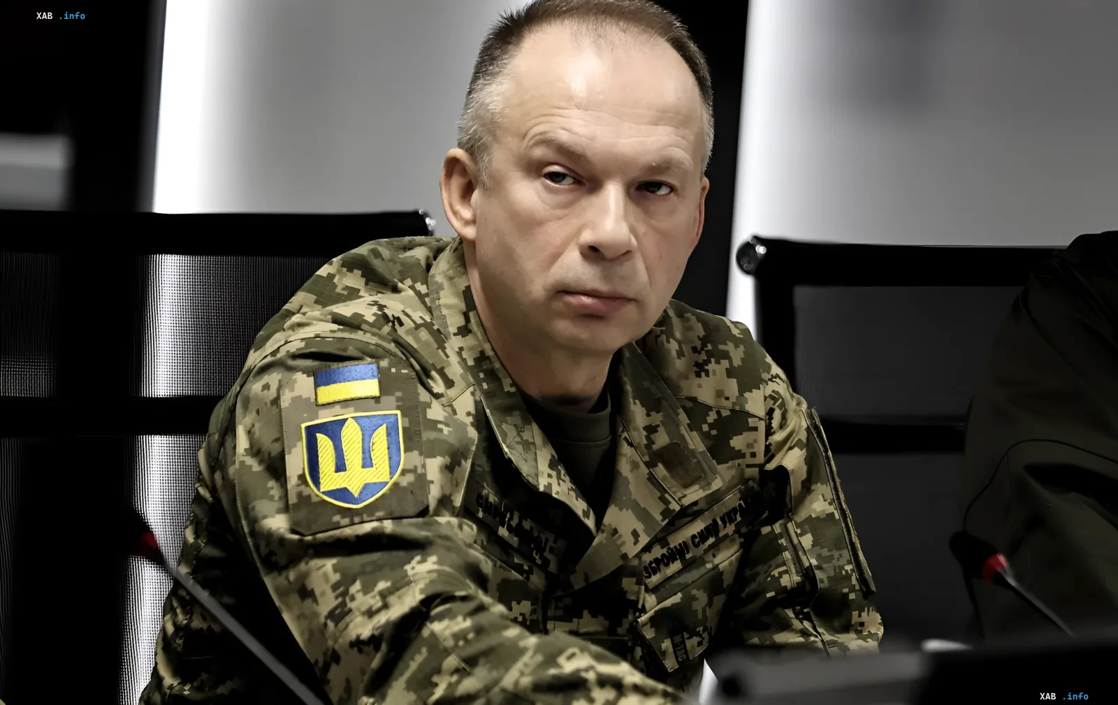 Oleksandr Syrsky in military uniform with Ukrainian emblem on sleeve, announcing drone strike statistics for June
