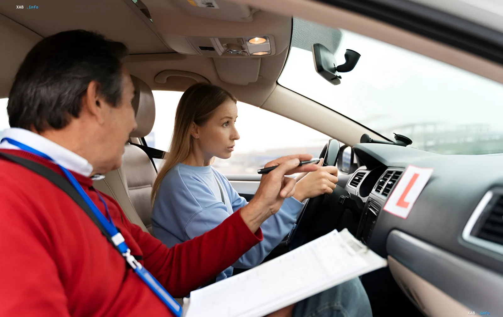 Driving instructor explains road rules to a student with an L plate, illustrating preparation for a driving test in the context of changes after Ukraine joins the EU