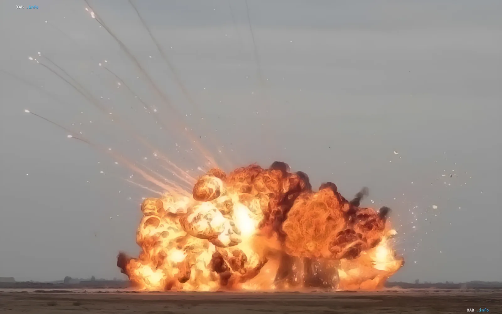 Massive KAB explosion in Kharkiv's Kyivskyi district: fiery blast and debris against barren landscape