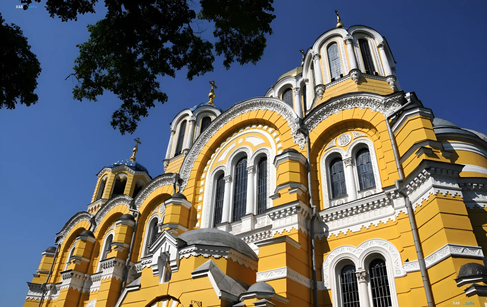 Golden domes of an Orthodox church against a clear sky — symbol of the Baptism of Rus and the July 15 holiday
