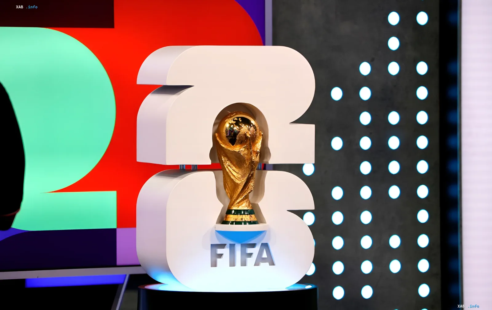 FIFA World Cup 2026 trophy displayed against the tournament logo, symbolizing the upcoming final between Spain and Argentina