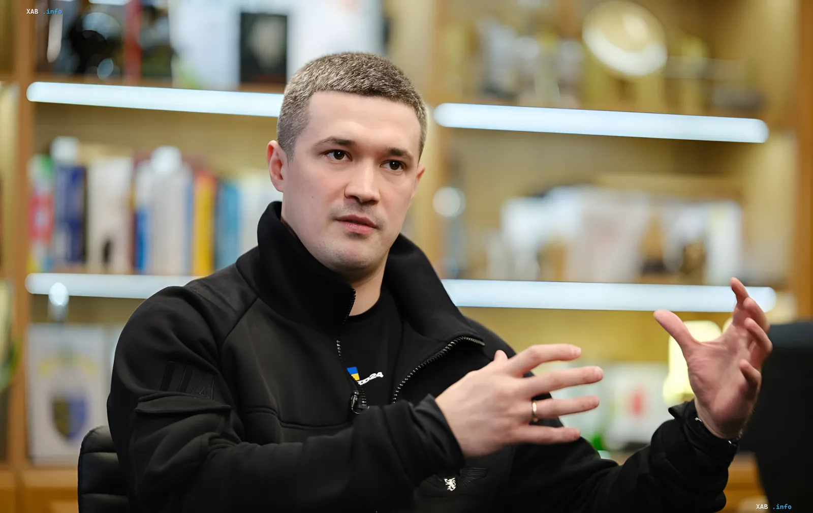 Mykhailo Fedorov in an office, gesturing during a discussion about army reform