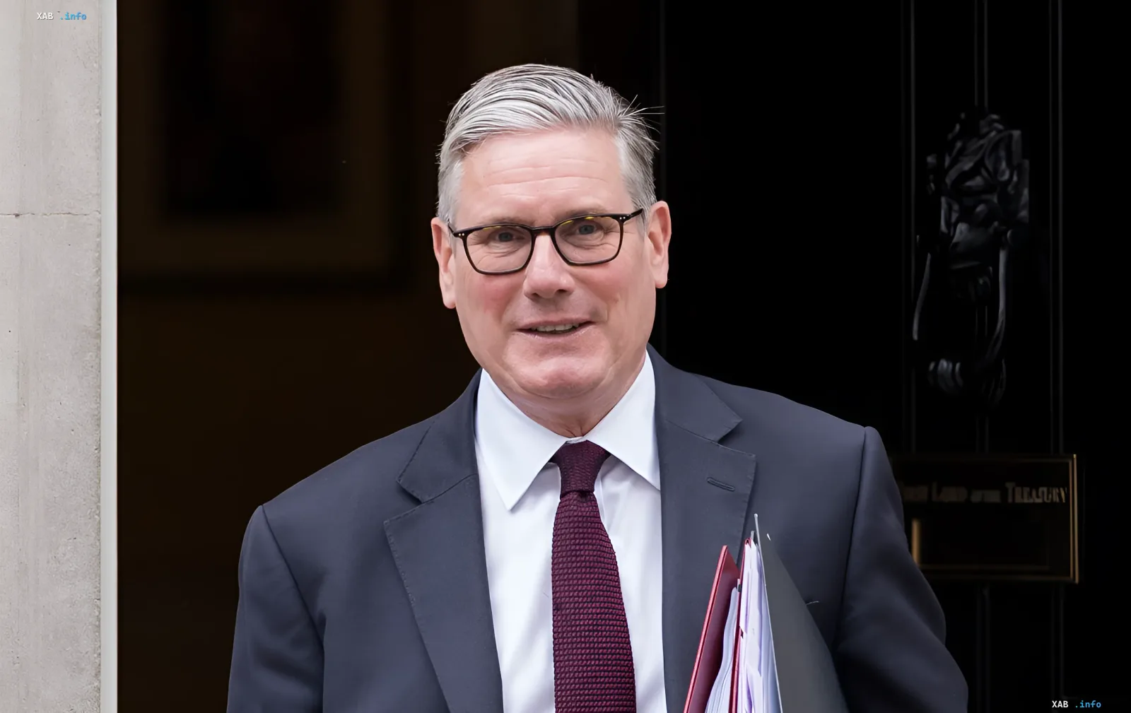UK Defence Secretary Kevin Hollingworth exits Treasury building with documents — in context of £300M allocation for 16 modern fighter jets for Ukraine