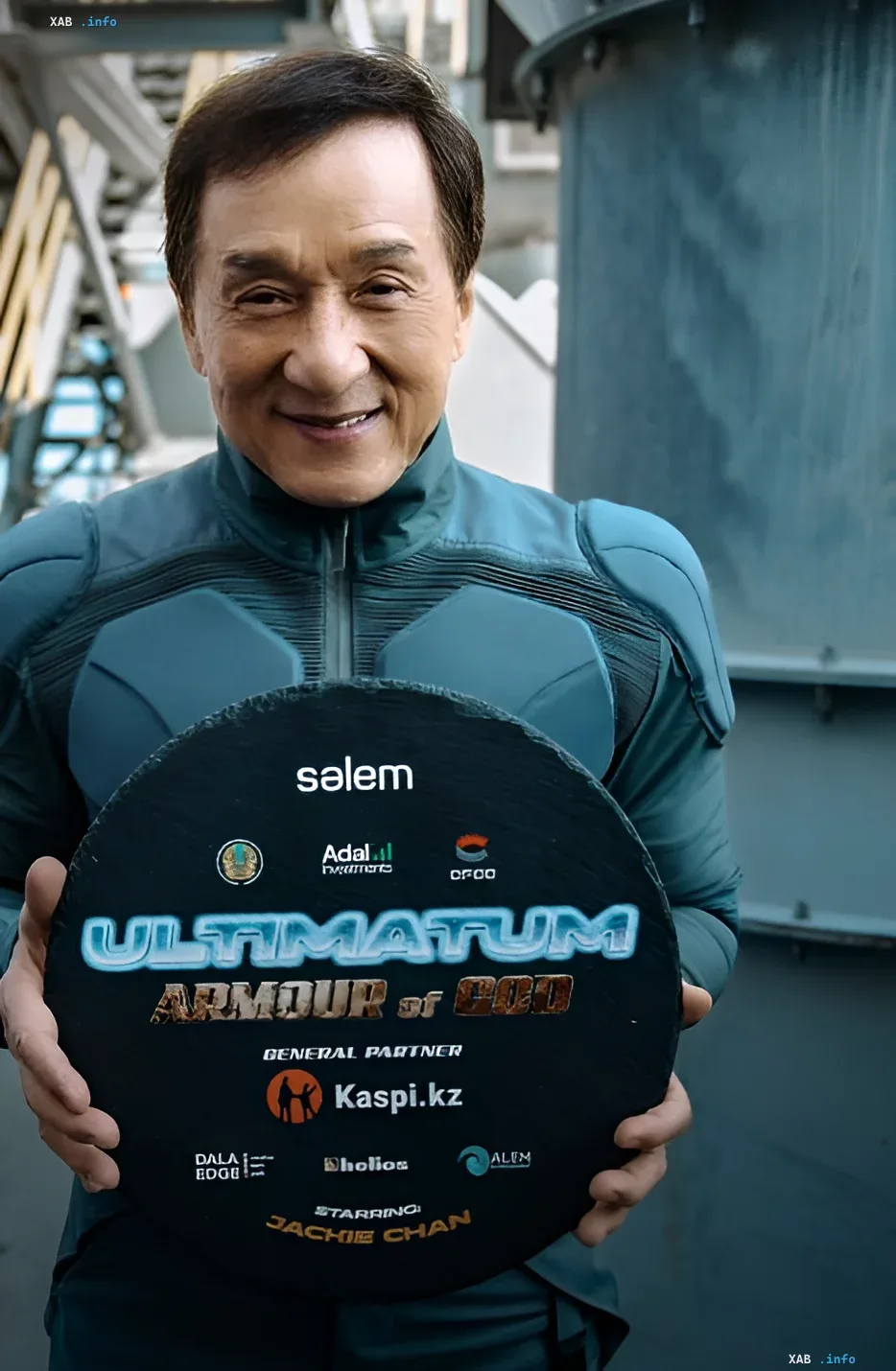 Jackie Chan on the set of 'Armour of God 4' in Kazakhstan Jackie Chan in futuristic costume holding a shield with logos of partners for the film 'Armour of God 4' against an industrial backdrop