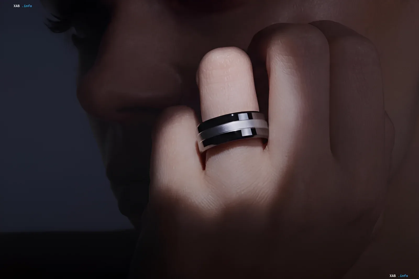 Male hand wearing the Signal Ring smart device on finger, showcasing health monitoring for hypertension