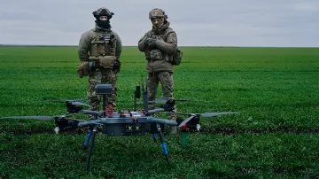 Ukrainian soldiers with combat drone in field — symbol of exporting war experience and tactics to allies