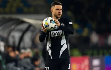 Alexey Gutsulyak in Kocaelispor kit holding a football, symbolizing his transfer to the Turkish club