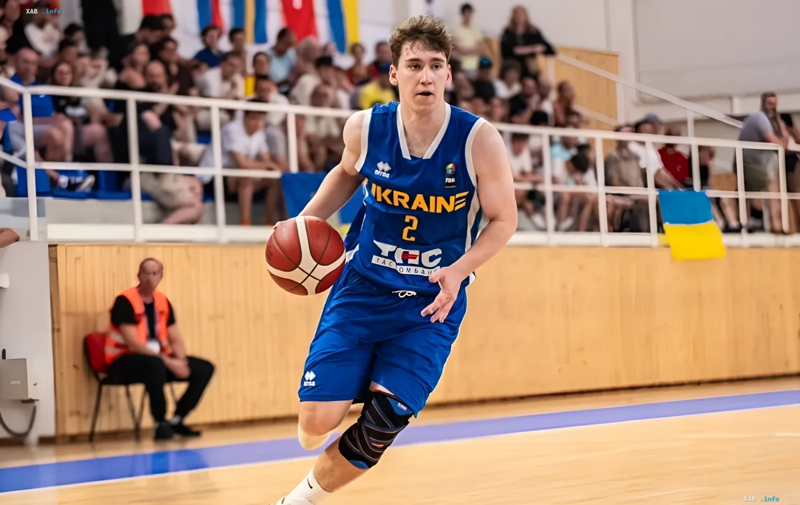 Yehor Sushkin in Ukraine national team jersey #2 dribbling basketball during Youth EuroBasket match