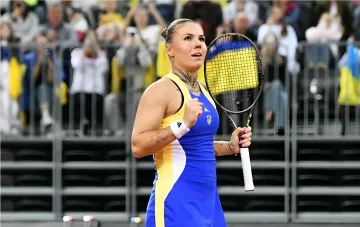 Ukrainian tennis player Oleksandra Oliynykova celebrates a victory in a match at the WTA 250 tournament in Iasi