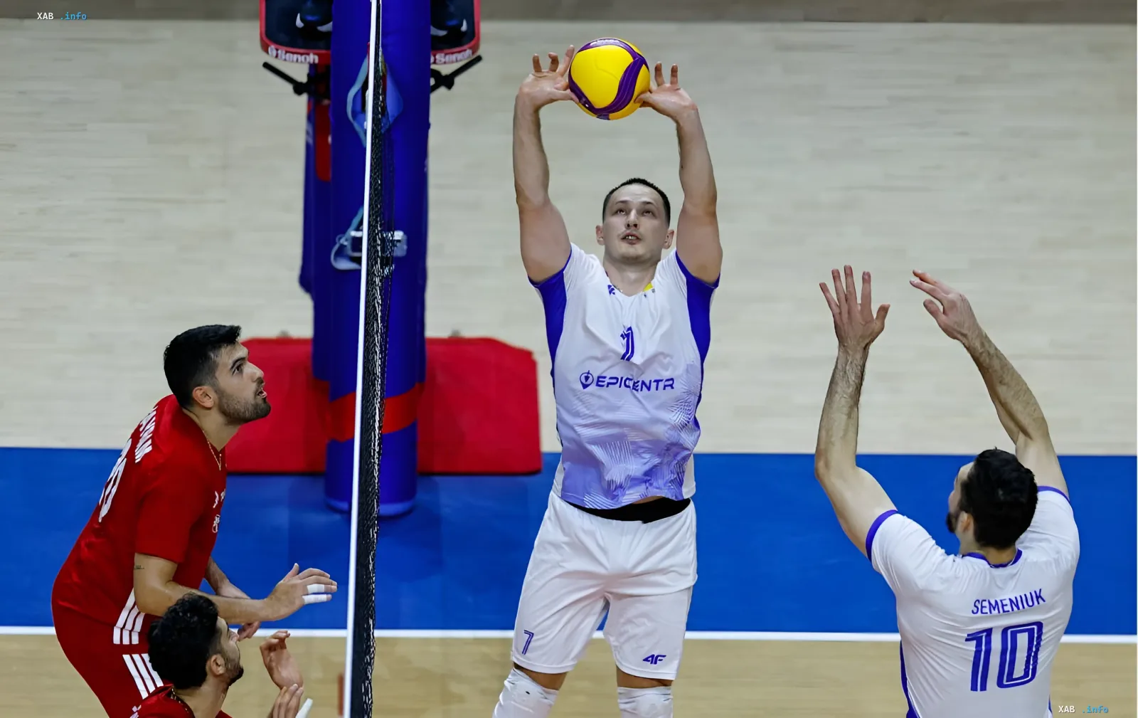 Player of the Ukrainian national volleyball team in a white uniform with the EPICENTRA logo serves the ball during a match against Turkey in the Nations League